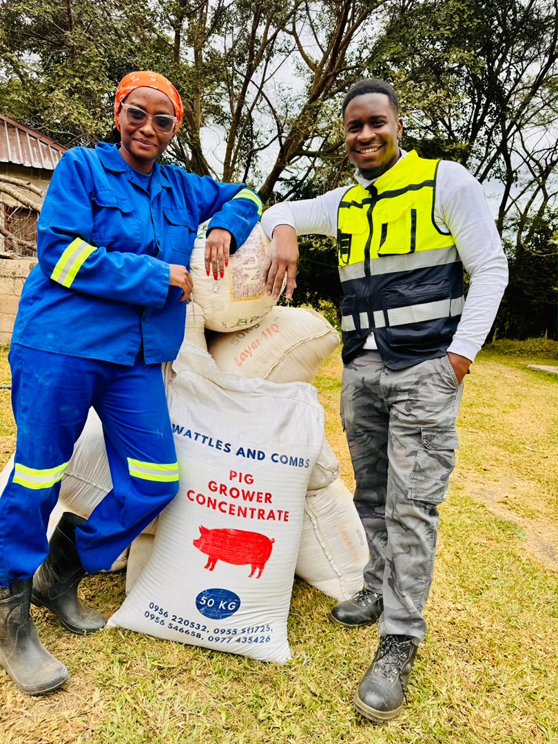 The team with bags of pig grower feed